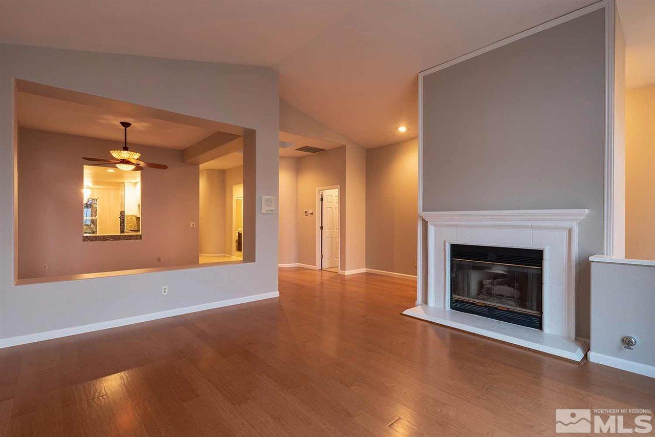 2969 Mountain Springs Road Reno, NV 89519 - Photo 8 of 25 a view of an empty room with a fireplace and a window