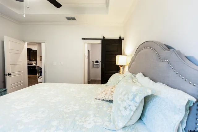 a bedroom with a bed and a dresser