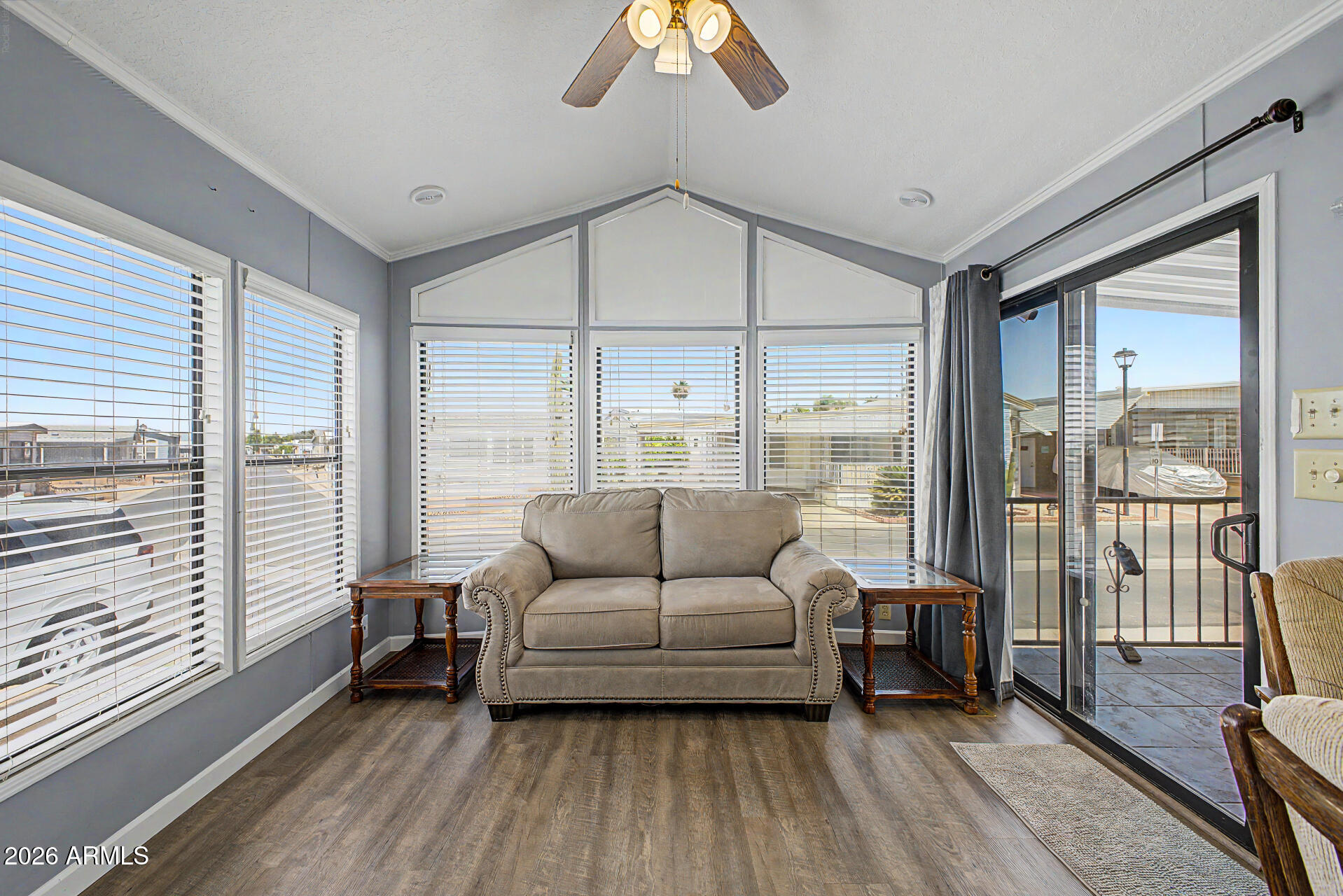 7750 East Broadway Road, Unit 560 Mesa, AZ 85208 - Photo 3 of 18 a living room with furniture and a large window