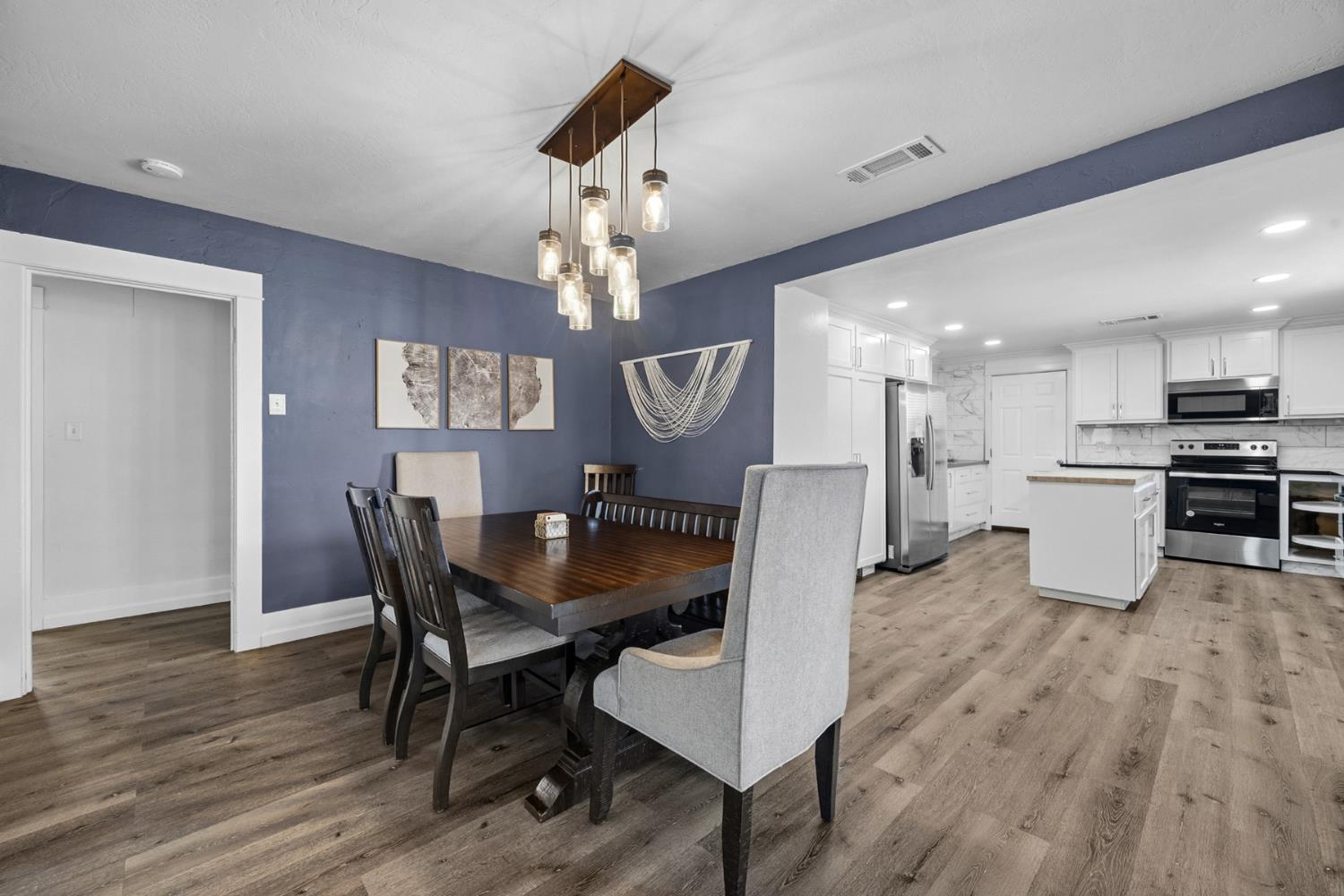 29205 Road 210 Exeter, CA 93221 - Photo 13 of 44 a view of a dining room with furniture and wooden floor