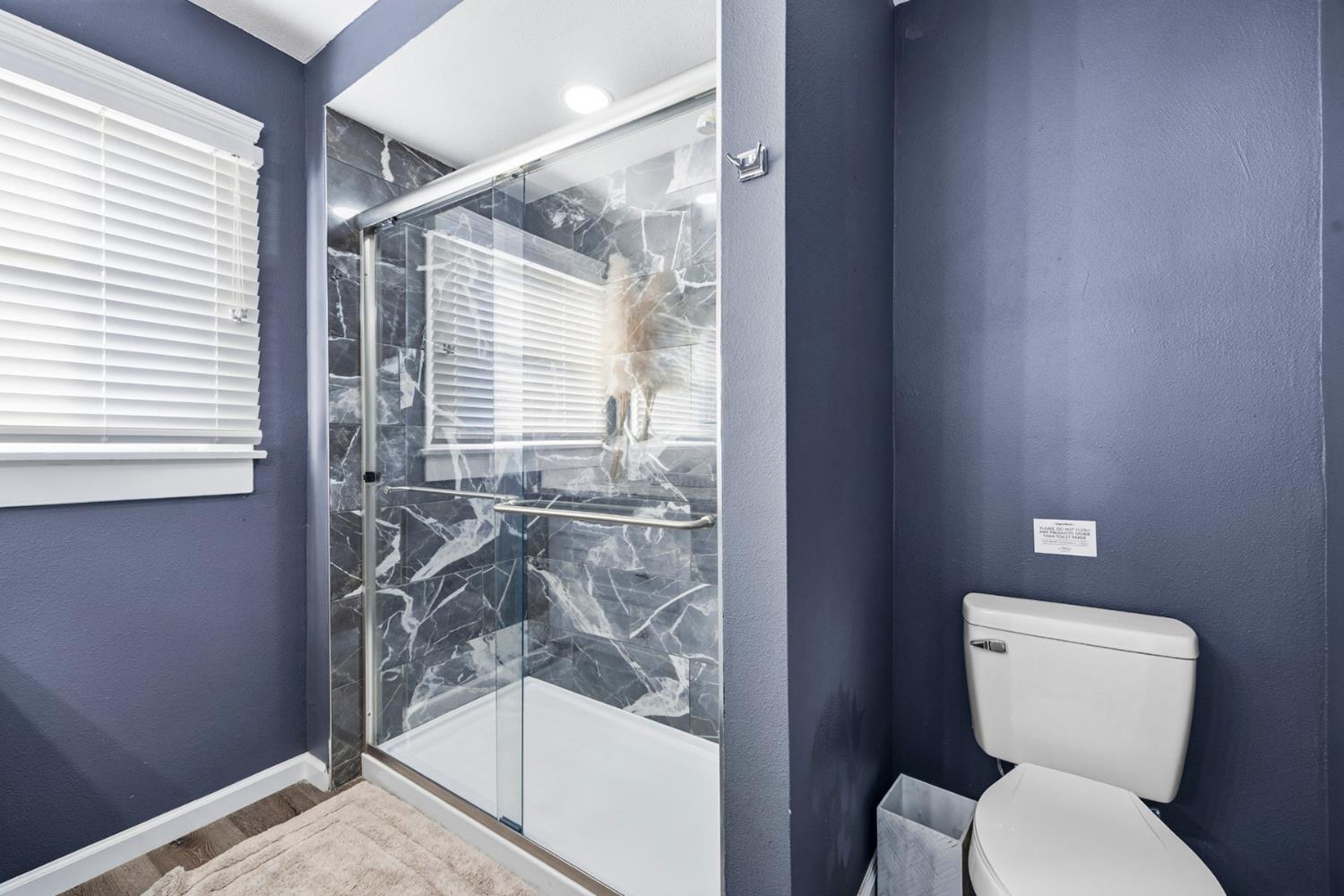 29205 Road 210 Exeter, CA 93221 - Photo 24 of 44 a bathroom with a toilet and a shower