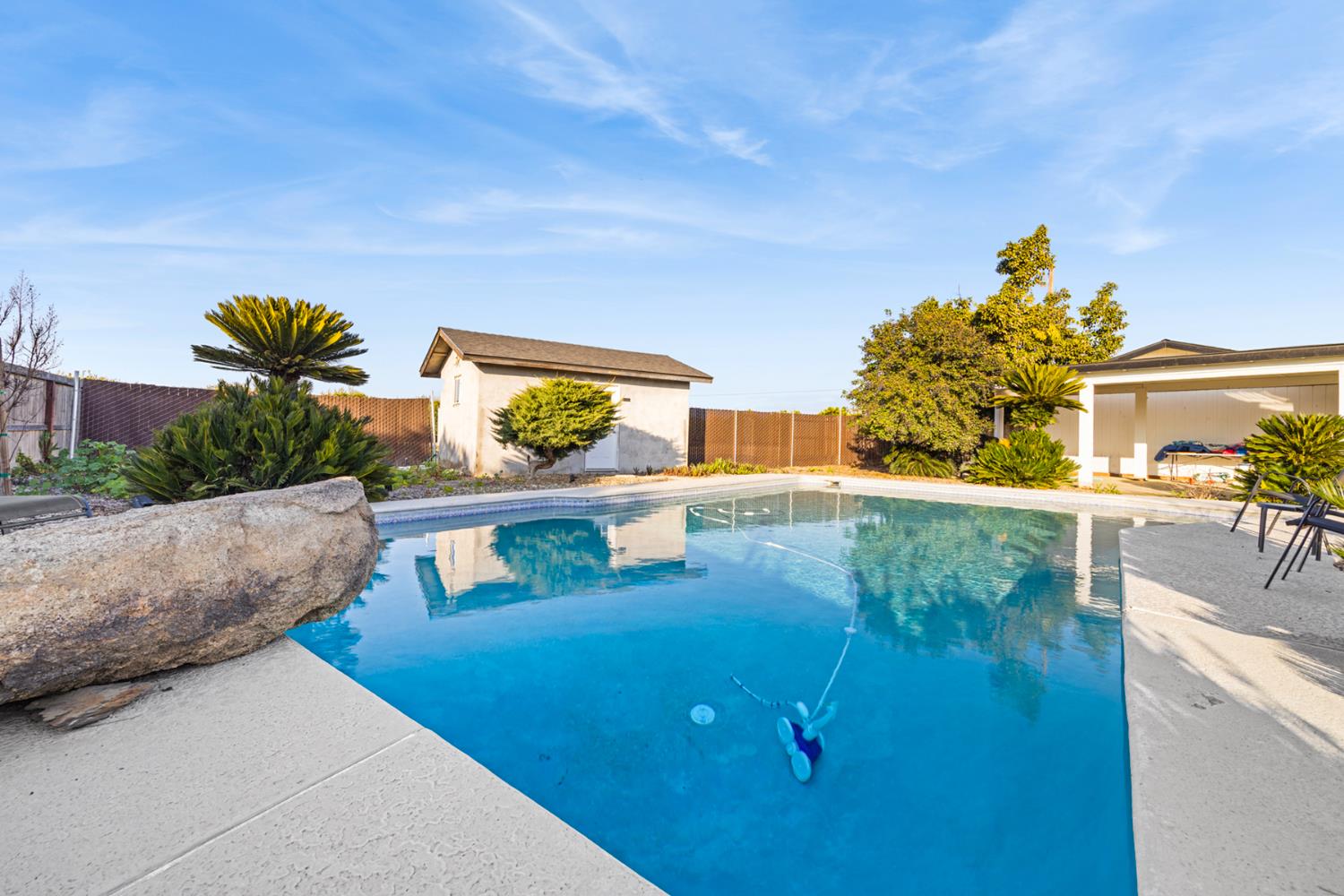 29205 Road 210 Exeter, CA 93221 - Photo 33 of 44 a view of a swimming pool with a yard