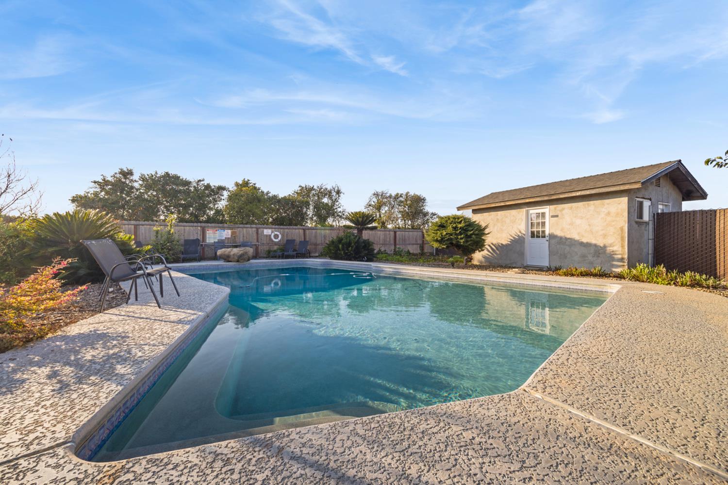 29205 Road 210 Exeter, CA 93221 - Photo 34 of 44 a view of a swimming pool with a yard