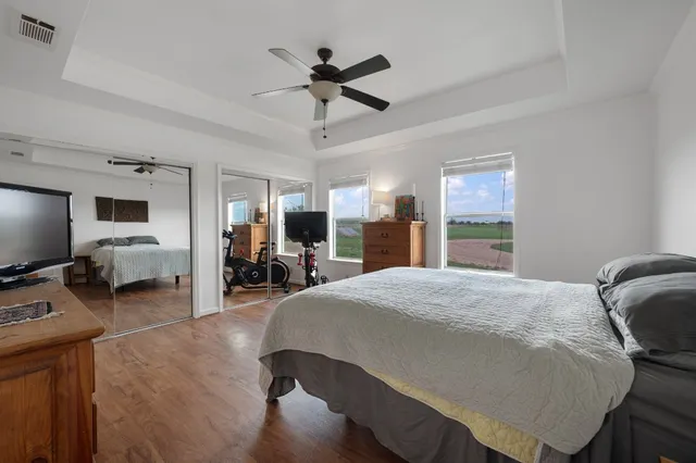 a bed room with a bed window and a television
