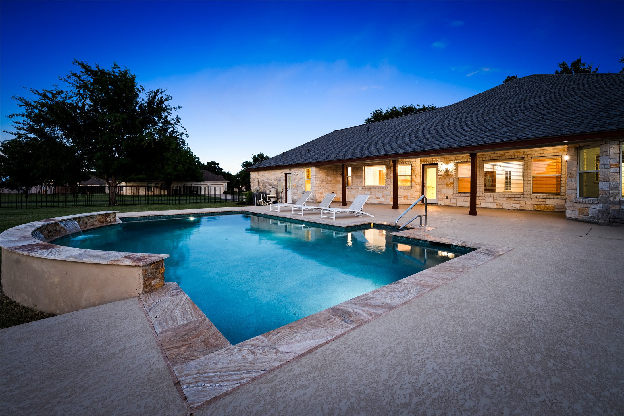 110 Starlight Trail Georgetown, TX 78633 - Photo 1 of 36 Expansive patio and glowing pool—perfect for Texas evenings