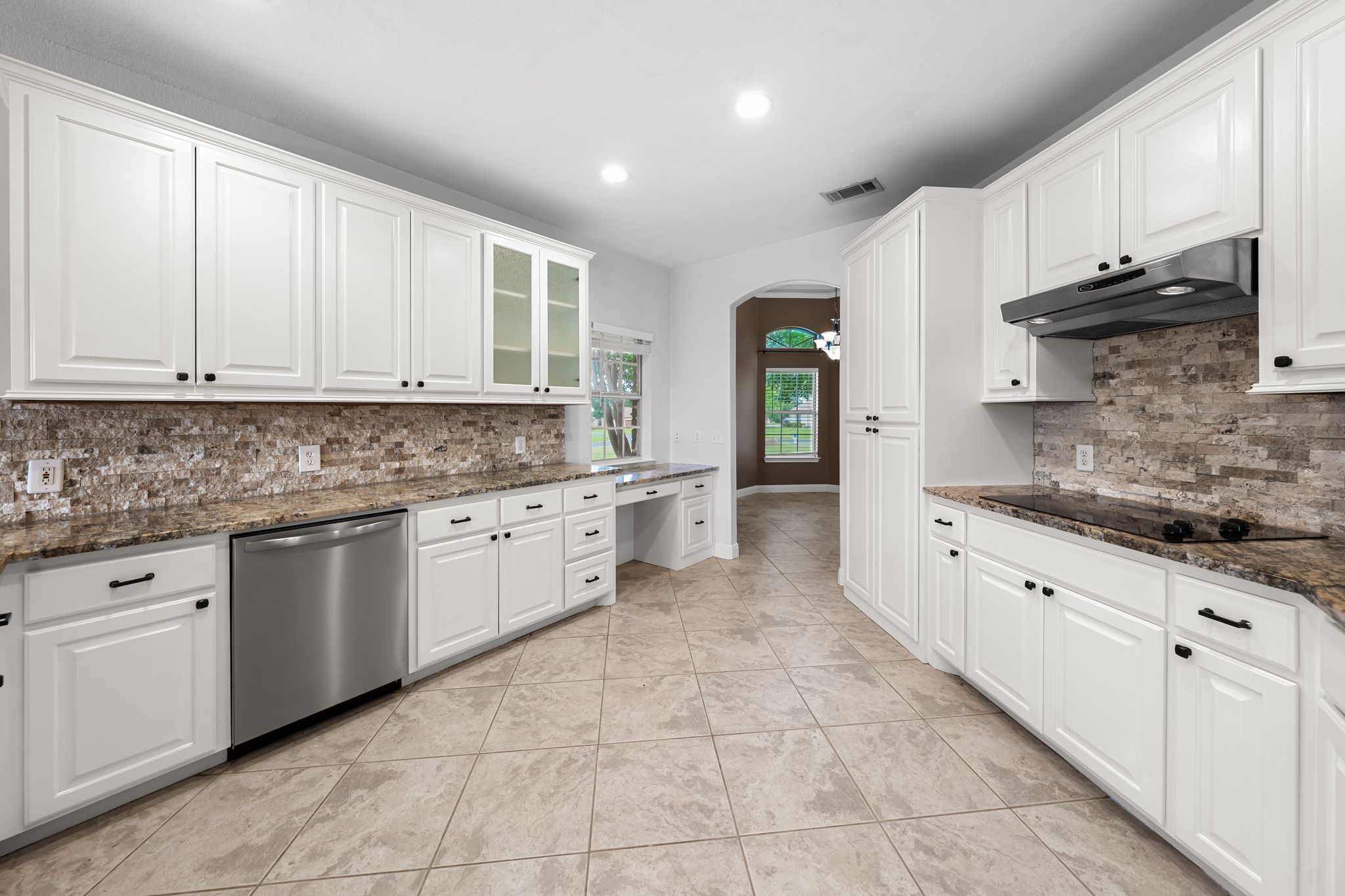 110 Starlight Trail Georgetown, TX 78633 - Photo 11 of 36 Crisp white cabinetry, stainless steel, and tons of counter space