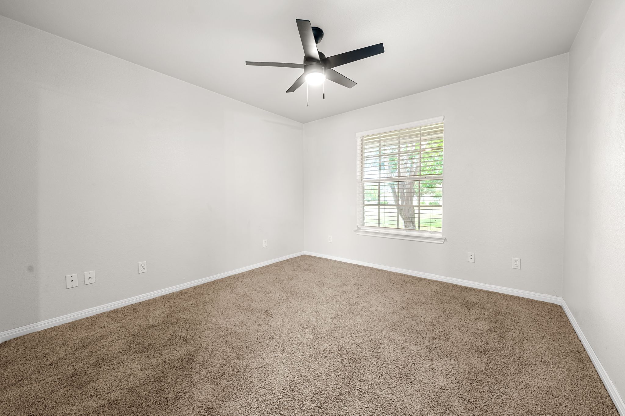 110 Starlight Trail Georgetown, TX 78633 - Photo 18 of 36 Spacious secondary bedroom with natural light and modern fan