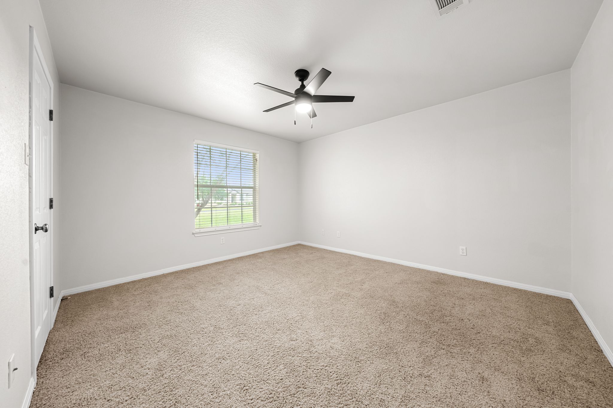 110 Starlight Trail Georgetown, TX 78633 - Photo 20 of 36 Comfortable bedroom with large window and ceiling fan