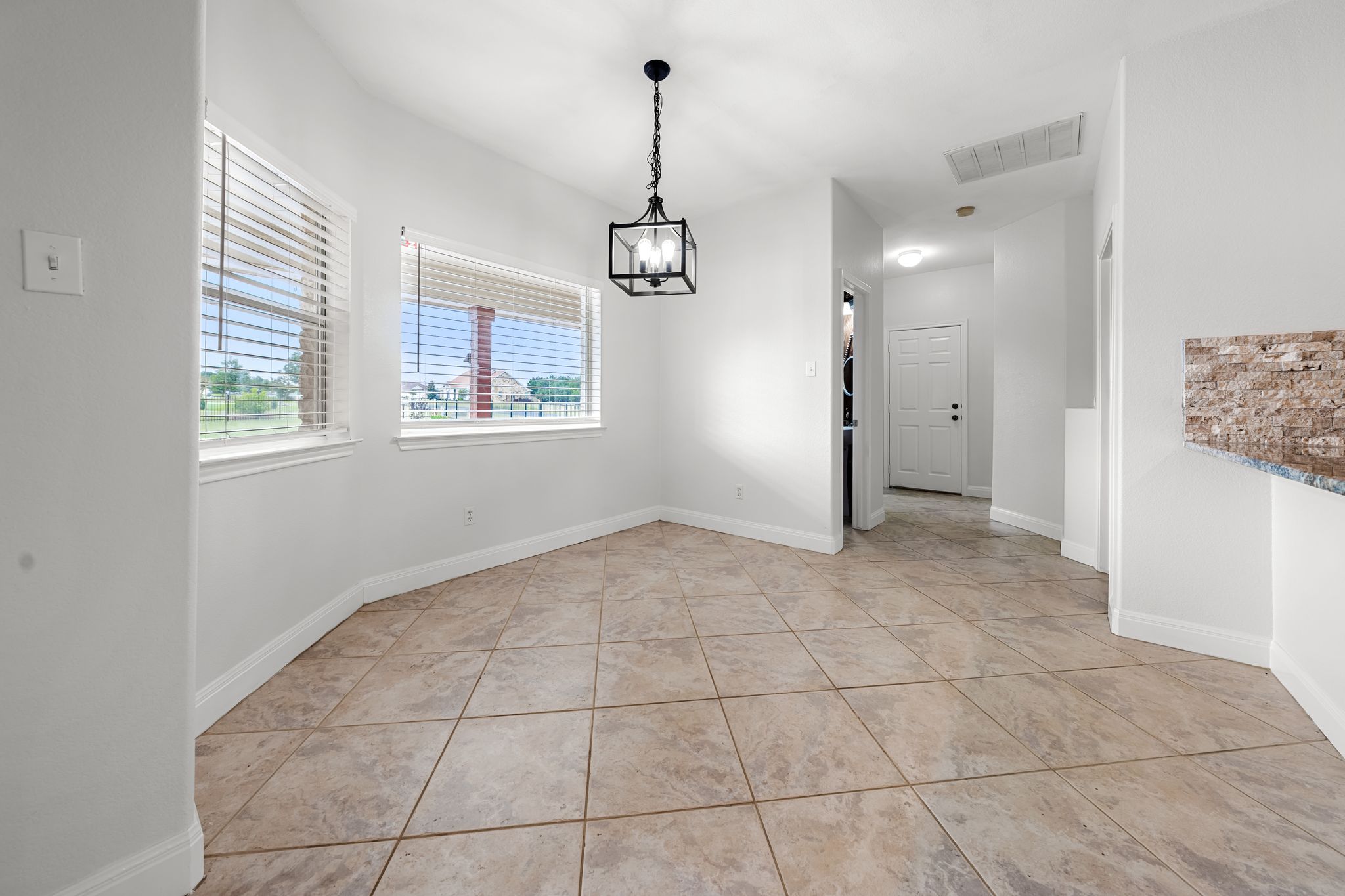 110 Starlight Trail Georgetown, TX 78633 - Photo 25 of 36 Bright eat-in kitchen with backyard and pool views