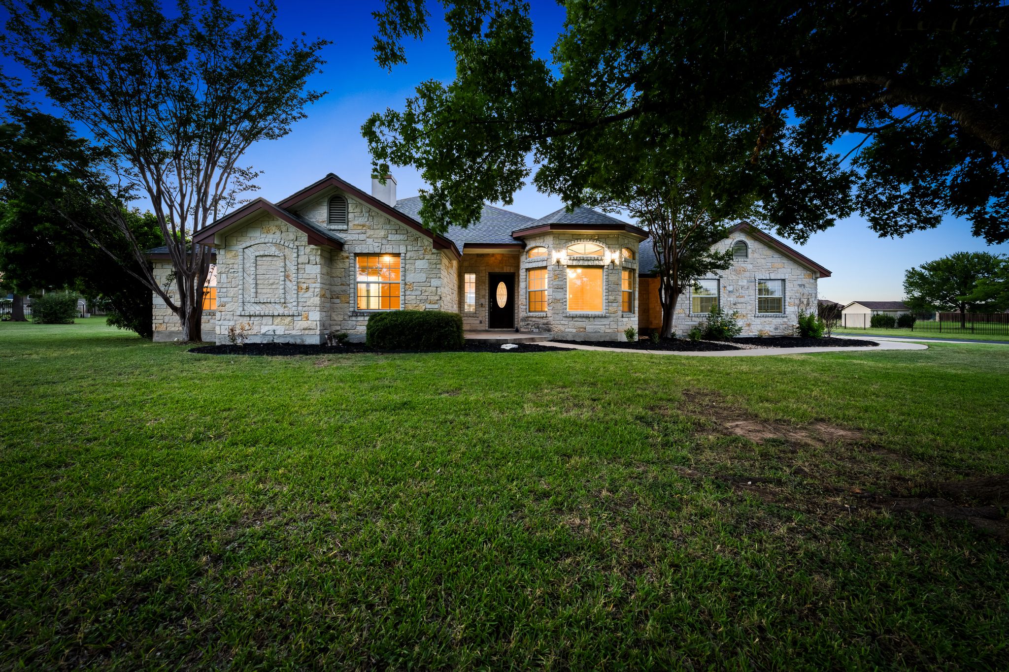 110 Starlight Trail Georgetown, TX 78633 - Photo 3 of 36 Evening charm and curb appeal on over an acre