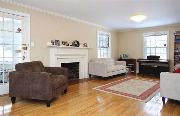 3 Woodside Road Newton, MA 02460 - Photo 3 of 6 a living room with furniture and a fireplace