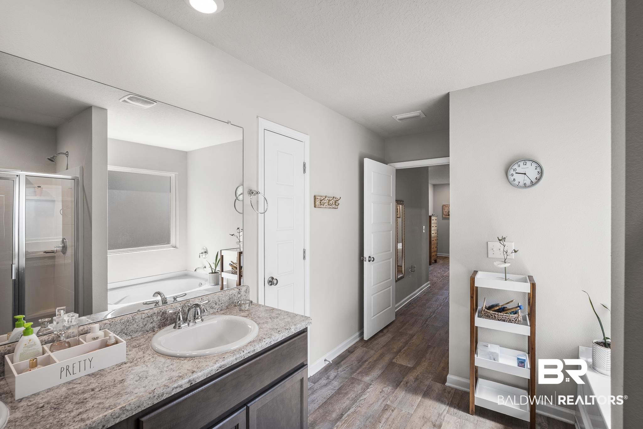 10232 Brodick Loop Spanish Fort, AL 36527 - Photo 16 of 29 Full bathroom with a shower stall, a bath, wood finished floors, baseboards, and vanity