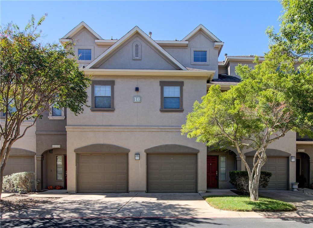 11203 Ranch Road 2222, Unit 1005 Austin, TX 78732 - Photo 1 of 1 a front view of a house with garden