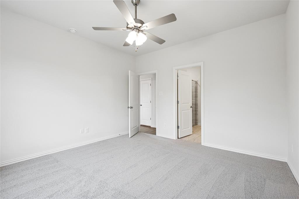 3900 Coco Lane Sherman, TX 75090 - Photo 9 of 40 Carpeted spare room featuring ceiling fan