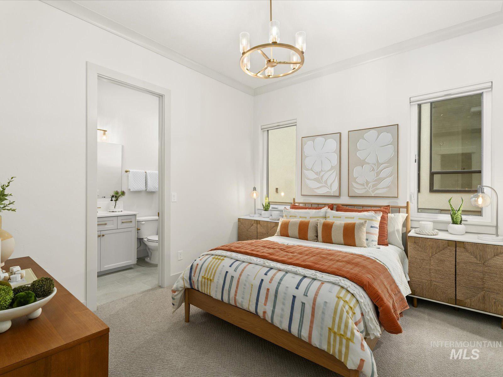 6161 East Prominence Court Boise, ID 83716 - Photo 29 of 45 Bedroom with hanging lights, light carpet, and ornamental molding