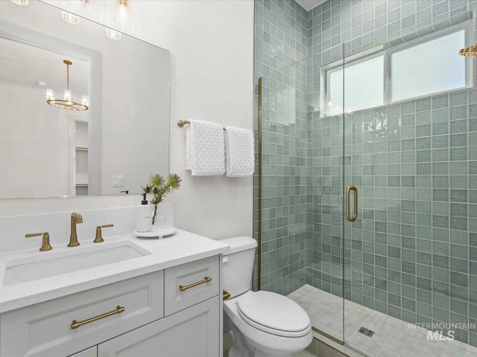 6161 East Prominence Court Boise, ID 83716 - Photo 30 of 45 Bathroom featuring vanity and a stall shower