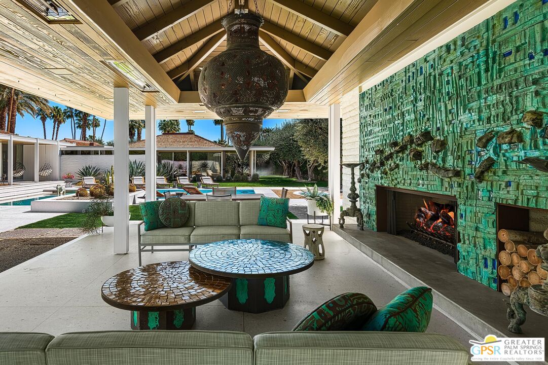 611 North Phillips Road Palm Springs, CA 92262 - Photo 8 of 10 a living room with furniture and a fireplace