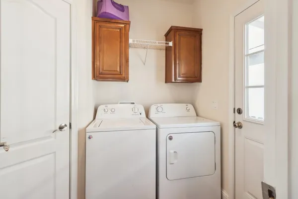 a utility room with dryer and washer