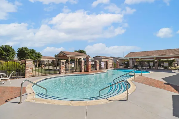 a view of a swimming pool with a lounge chairs