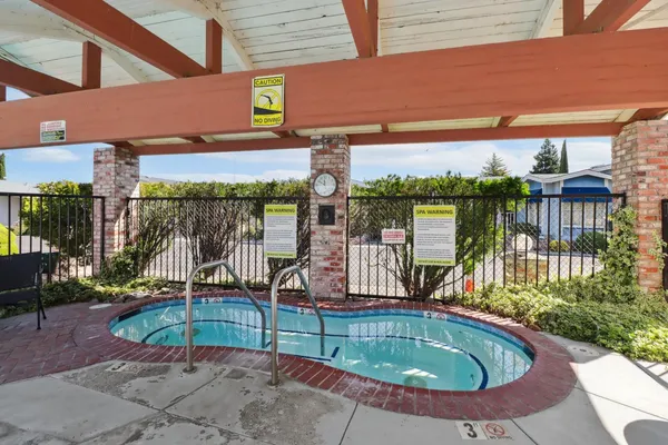 a view of a swimming pool with a patio