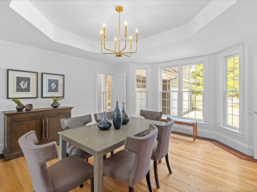 20 Laura Road Newton, MA 02468 - Photo 12 of 42 a view of a dining room with furniture window and wooden floor
