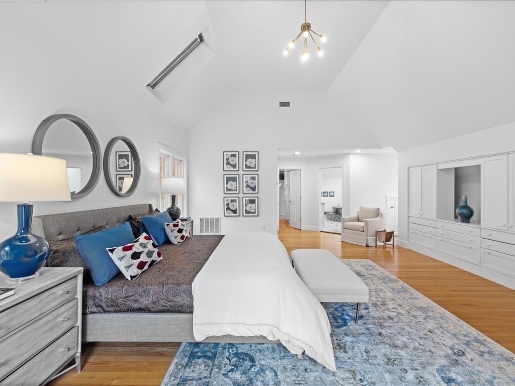 20 Laura Road Newton, MA 02468 - Photo 19 of 42 a large bedroom with furniture and wooden floor