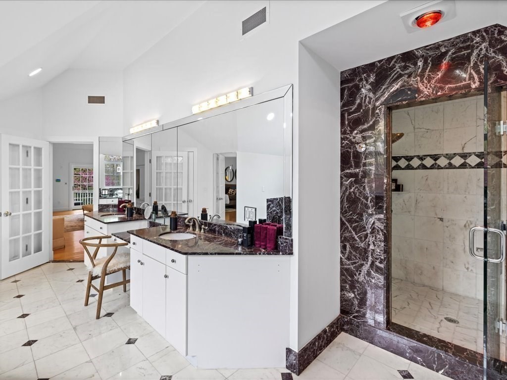 20 Laura Road Newton, MA 02468 - Photo 23 of 42 a bathroom with a sink double vanity and shower