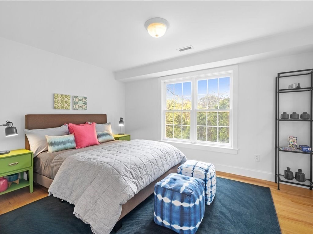 20 Laura Road Newton, MA 02468 - Photo 25 of 42 a bedroom with a bed and wooden floor