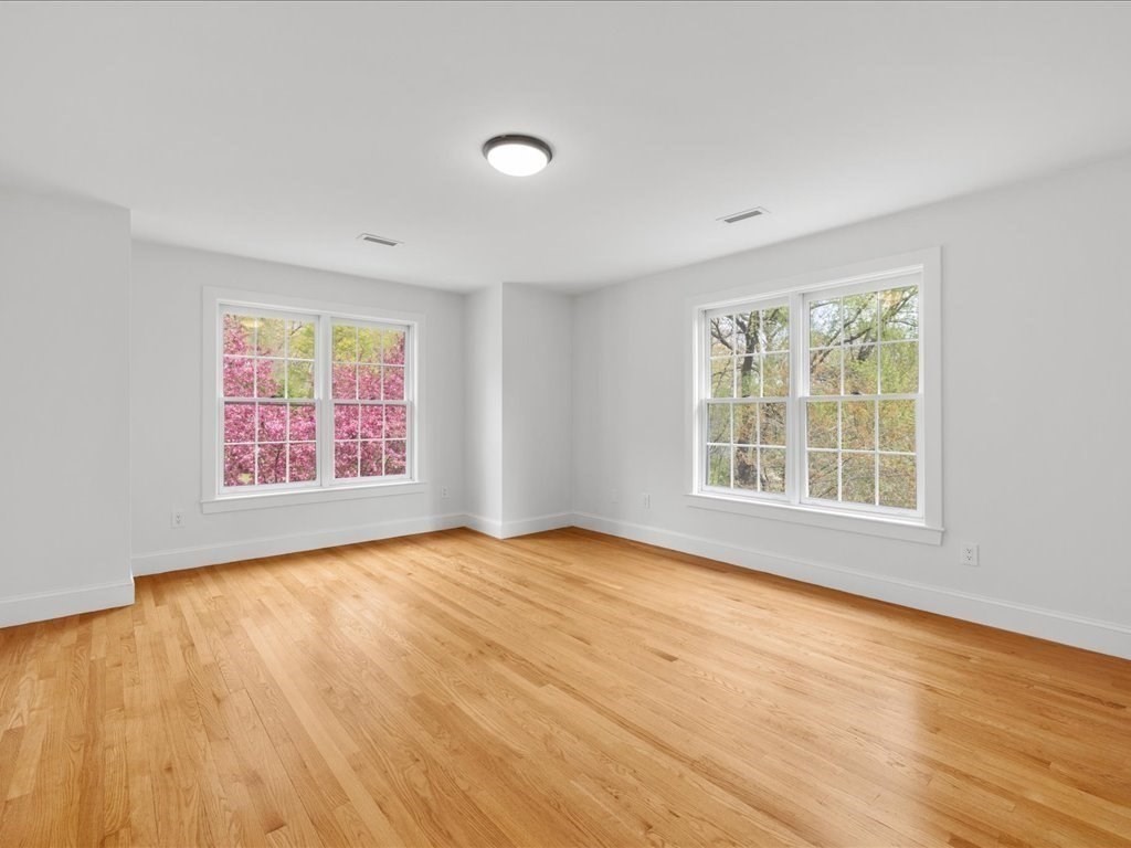 20 Laura Road Newton, MA 02468 - Photo 28 of 42 an empty room with wooden floor and windows