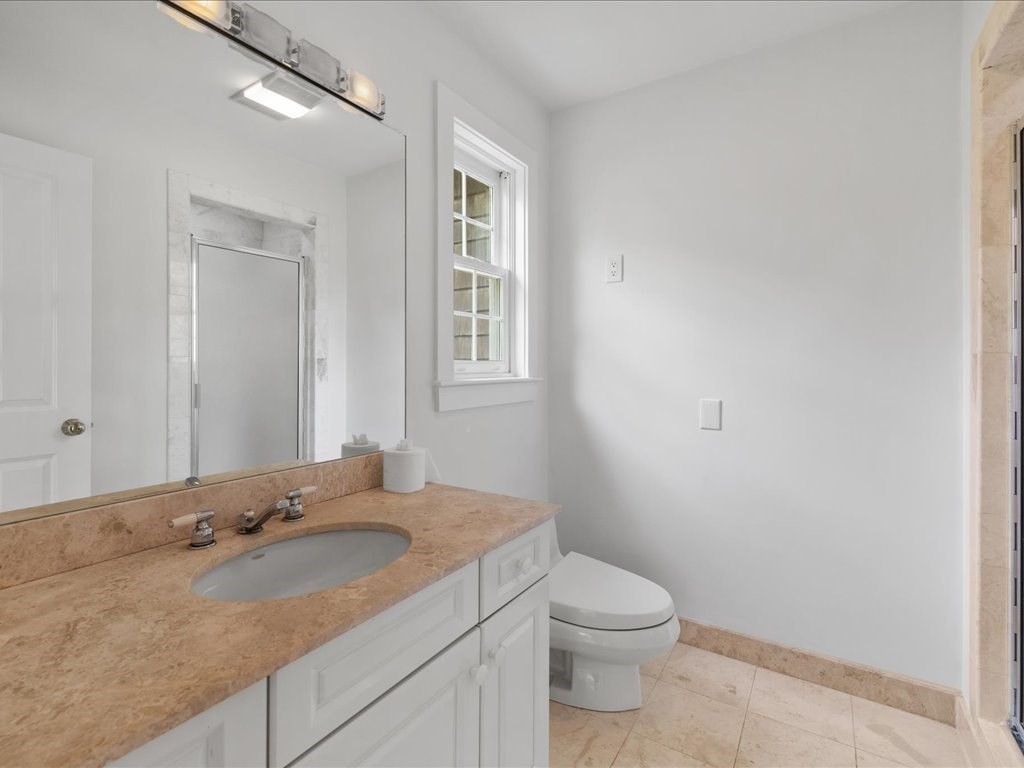 20 Laura Road Newton, MA 02468 - Photo 29 of 42 a bathroom with a granite countertop sink and a toilet