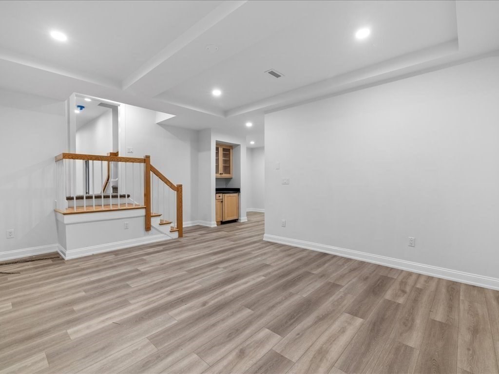 20 Laura Road Newton, MA 02468 - Photo 36 of 42 a view of an empty room with wooden floor