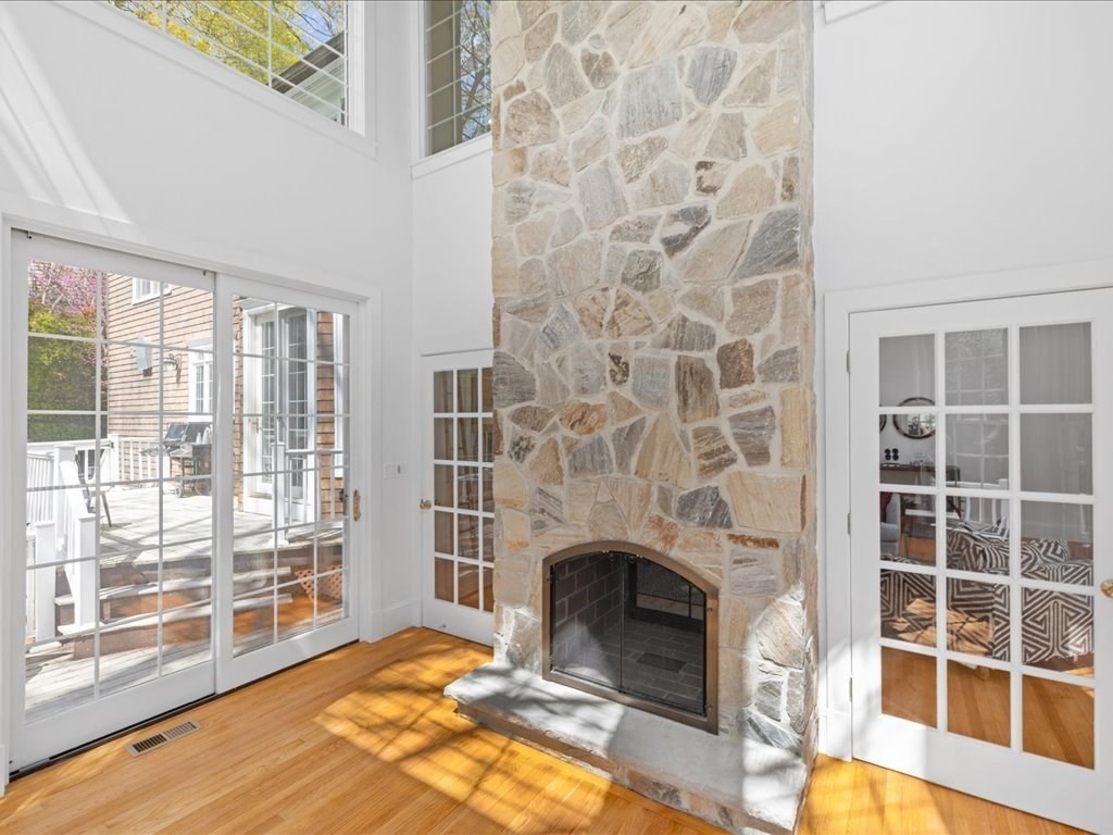 20 Laura Road Newton, MA 02468 - Photo 8 of 42 a living room with a fireplace and windows
