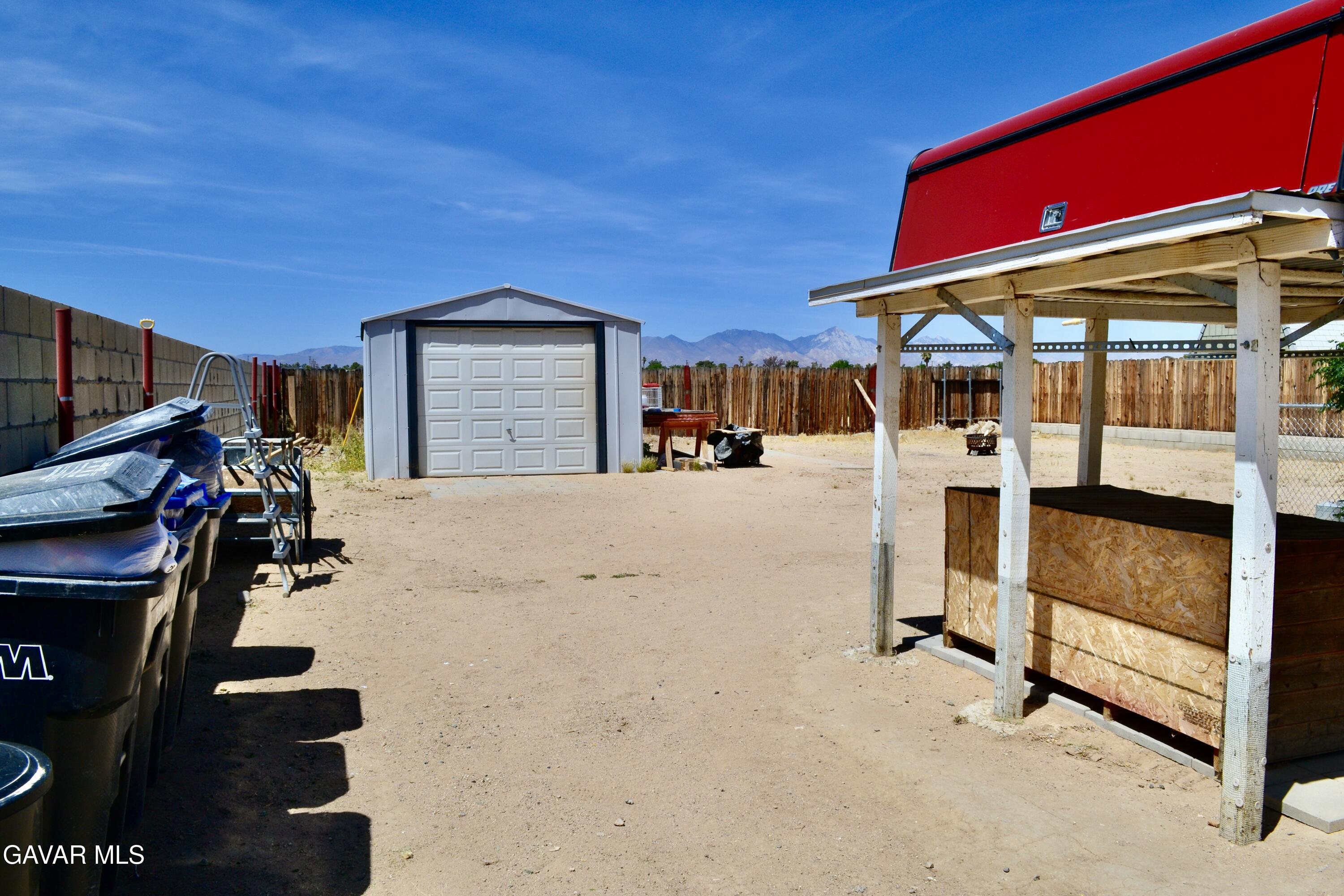 809 South Sunset Street Ridgecrest, CA 93555 - Photo 13 of 21 a view of a house with a yard