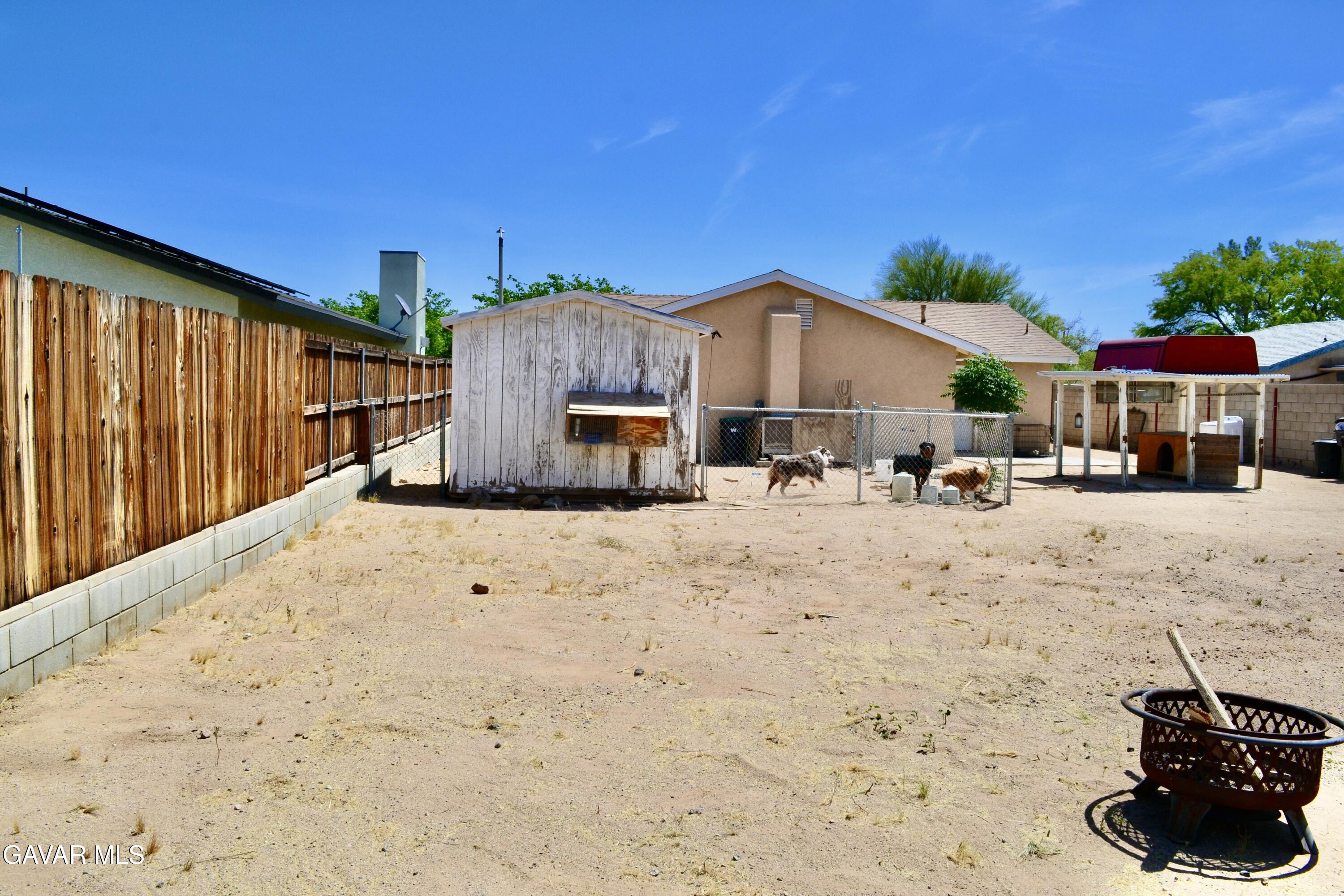 809 South Sunset Street Ridgecrest, CA 93555 - Photo 15 of 21 a view of a house with a yard