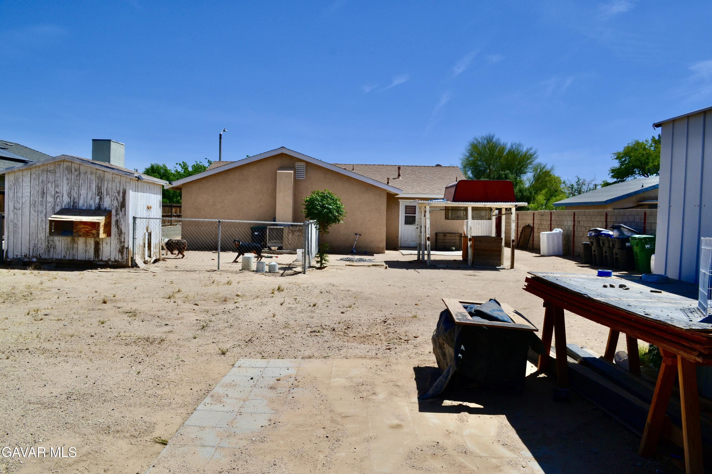 809 South Sunset Street Ridgecrest, CA 93555 - Photo 16 of 21 a view of a house with a yard