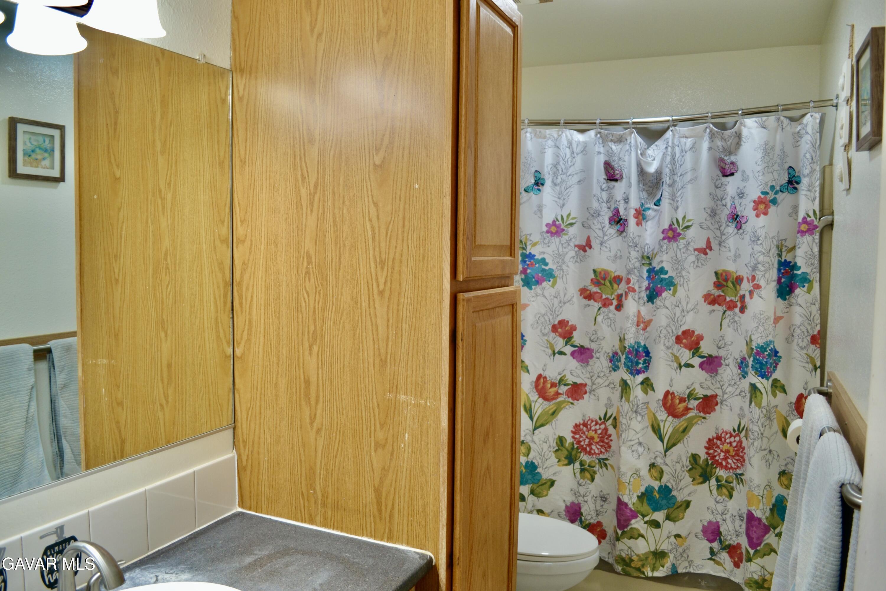809 South Sunset Street Ridgecrest, CA 93555 - Photo 7 of 21 a view of walk in closet with clothes and shoes