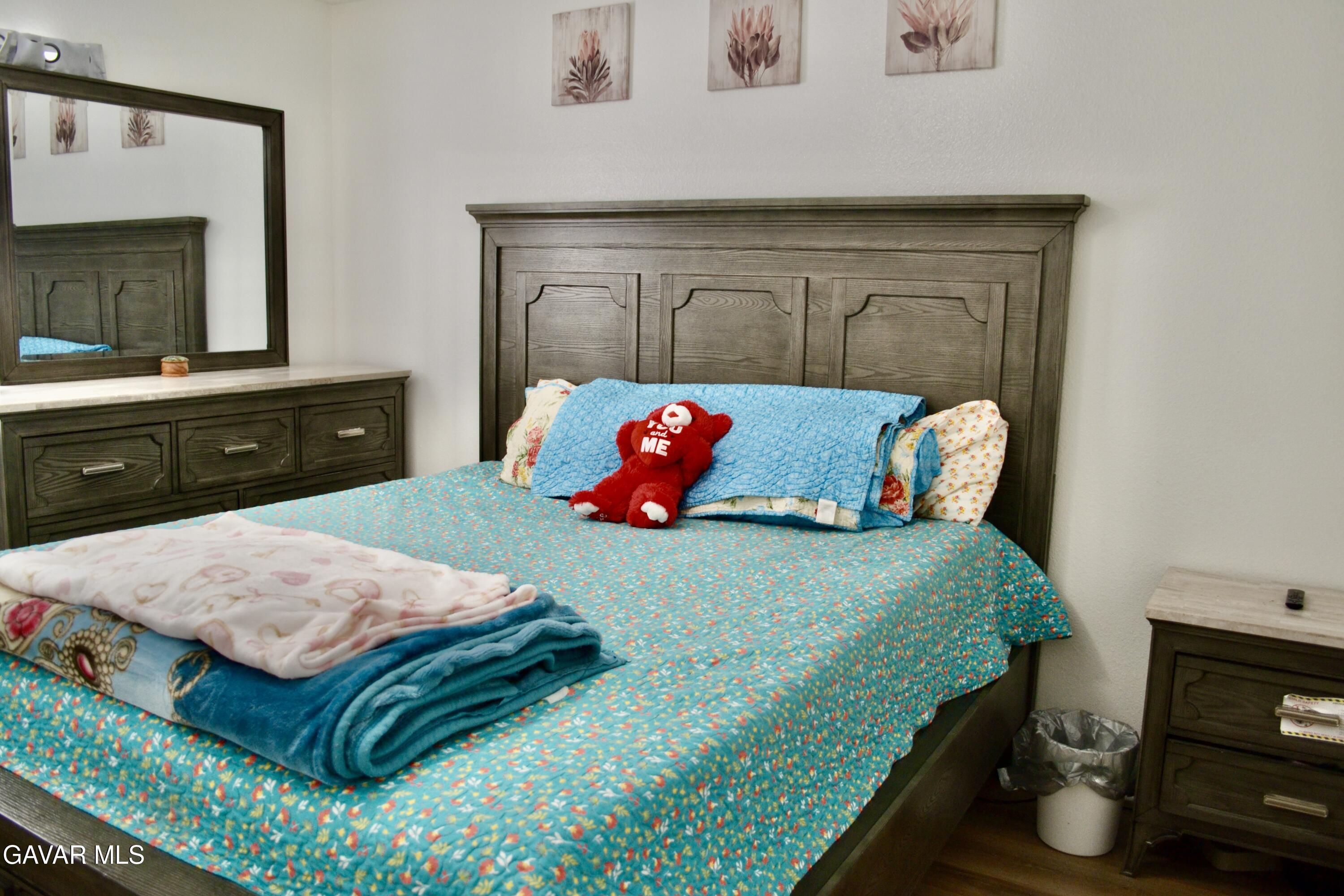 809 South Sunset Street Ridgecrest, CA 93555 - Photo 8 of 21 a bedroom with a bed and a dresser in it