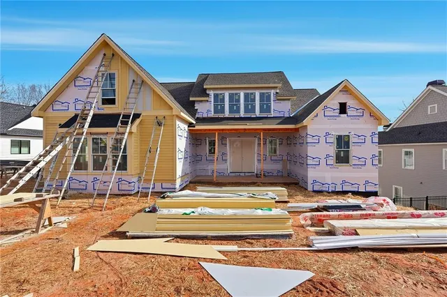 a front view of a house with a swimming pool