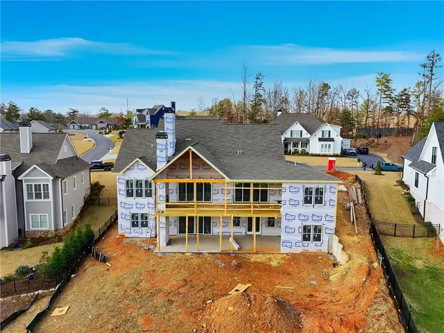 an aerial view of a house with a swimming pool