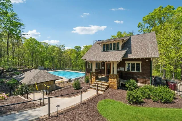 a tennis court with trees in the background