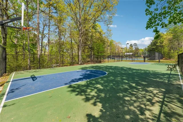 a view of a house with a swimming pool and a yard