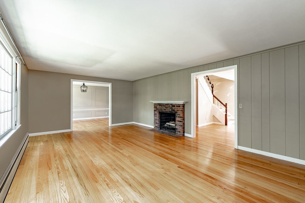 759 Williams Street Longmeadow, MA 01106 - Photo 15 of 40 a view of empty room with wooden floor and fireplace