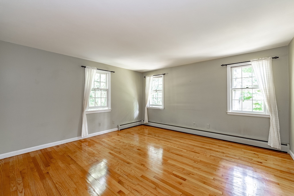759 Williams Street Longmeadow, MA 01106 - Photo 18 of 40 a view of an empty room with wooden floor and a window