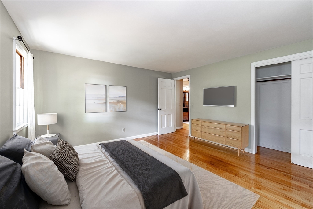 759 Williams Street Longmeadow, MA 01106 - Photo 21 of 40 a bedroom with a bed and wooden floor