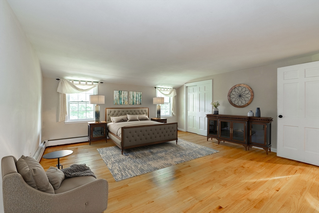 759 Williams Street Longmeadow, MA 01106 - Photo 26 of 40 a bedroom with a bed and a chandelier