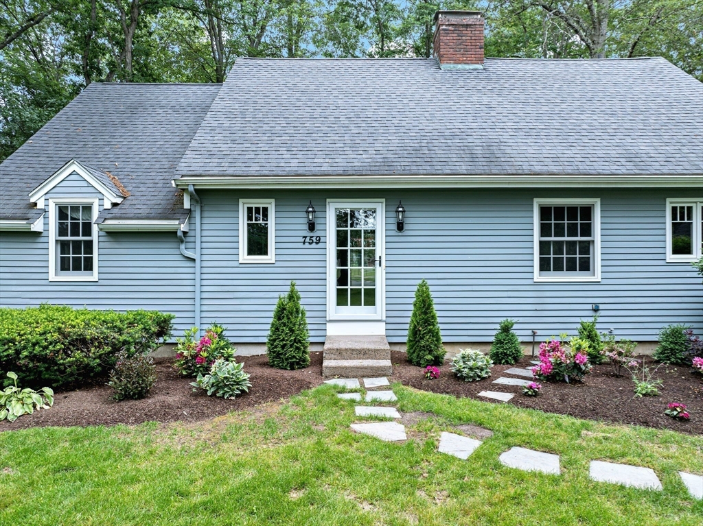759 Williams Street Longmeadow, MA 01106 - Photo 3 of 40 a front view of a house with a yard and a garden