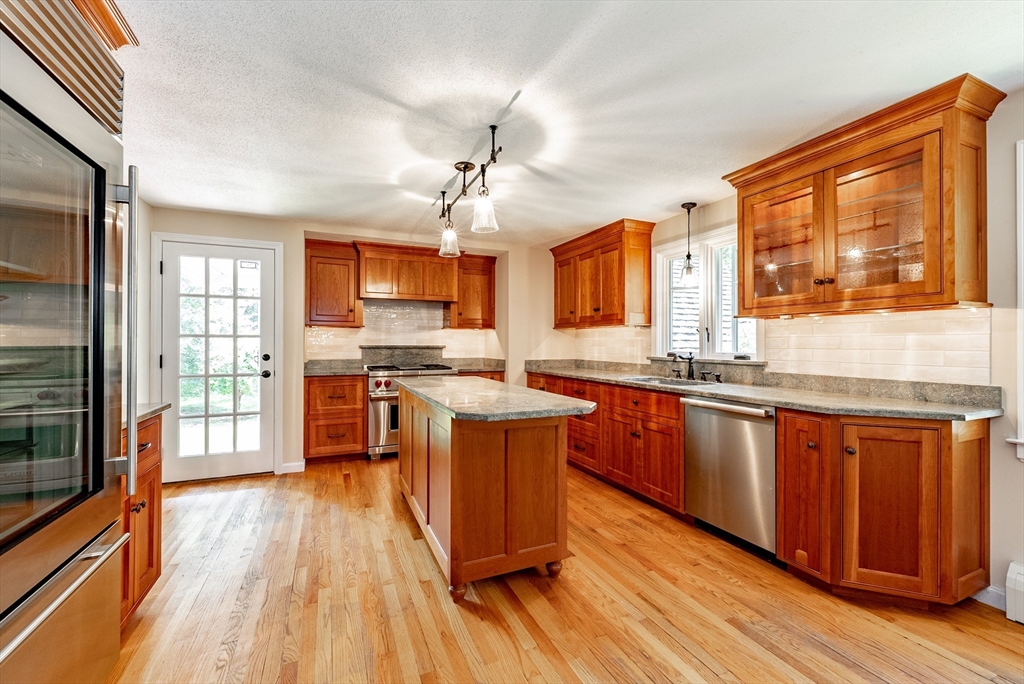 759 Williams Street Longmeadow, MA 01106 - Photo 5 of 40 a kitchen with stainless steel appliances granite countertop wooden floors and view living room