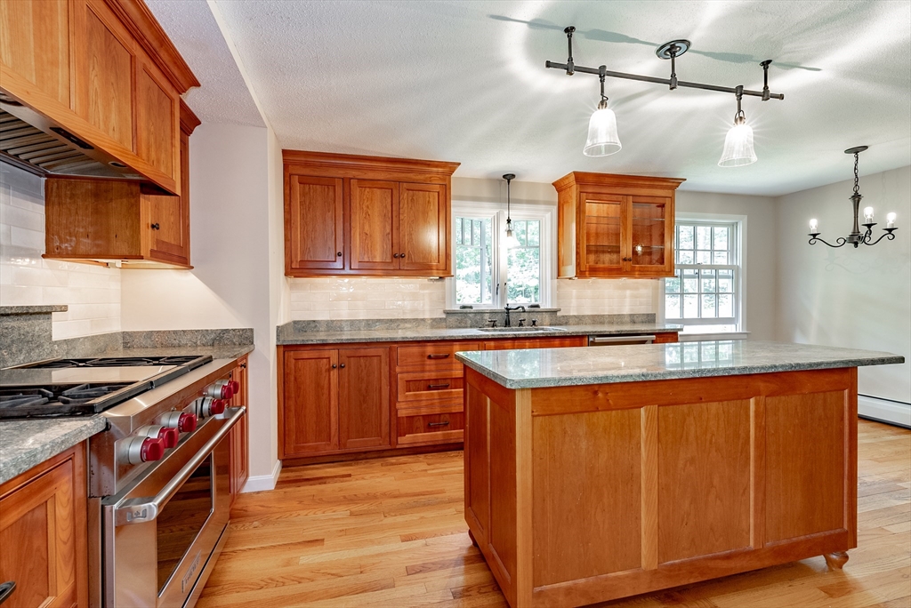 759 Williams Street Longmeadow, MA 01106 - Photo 7 of 40 a kitchen with stainless steel appliances granite countertop a stove a sink and a refrigerator
