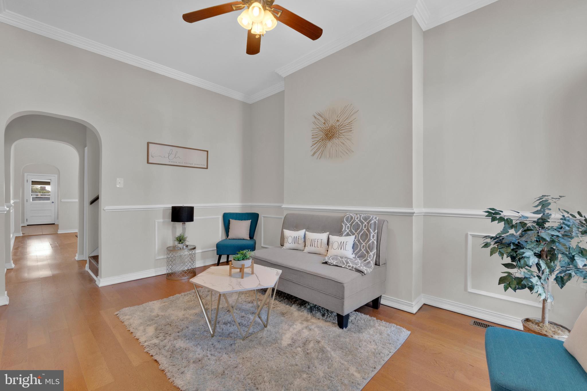 255 South Conkling Street Baltimore, MD 21224 - Photo 1 of 33 a living room with furniture and a potted plant