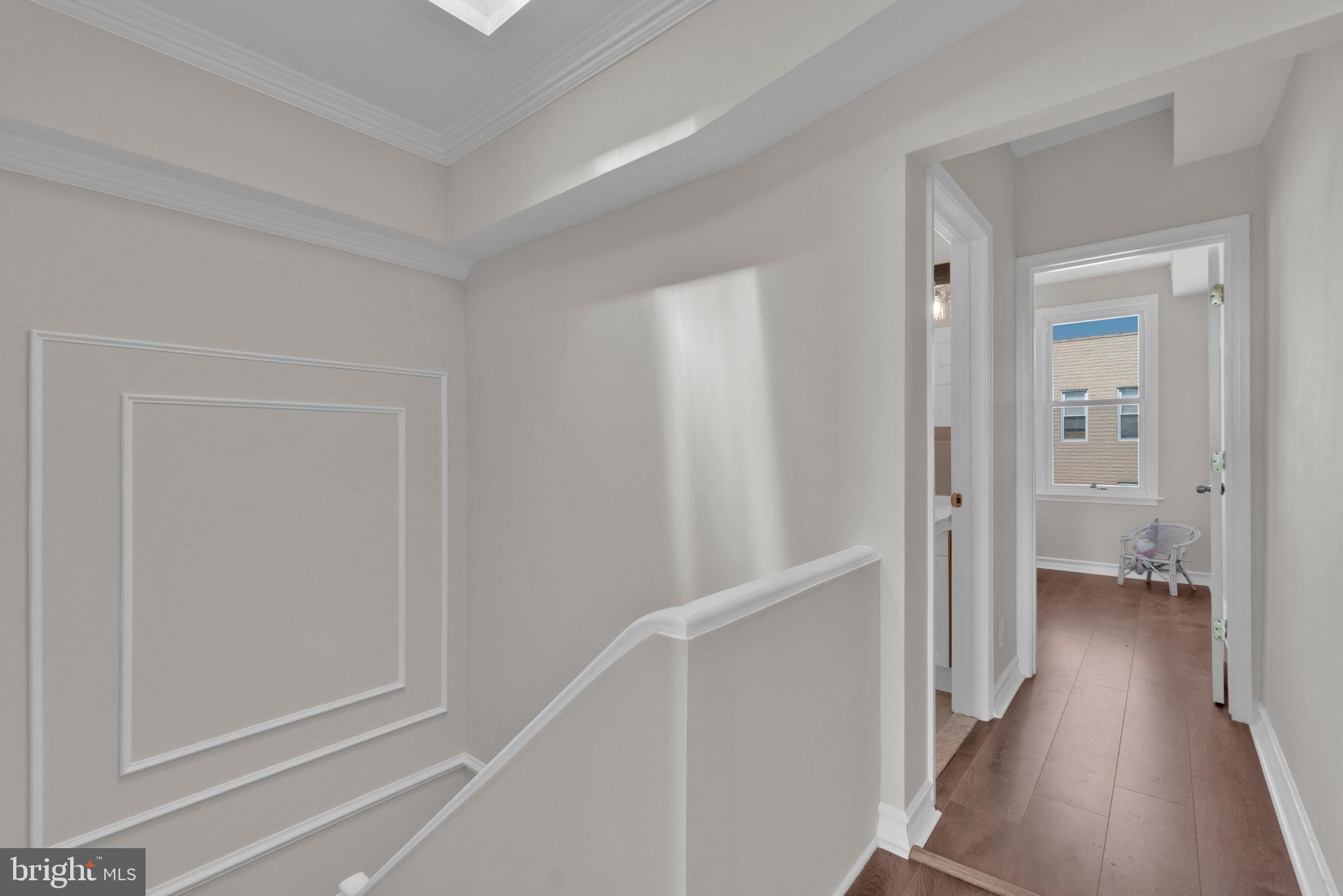 255 South Conkling Street Baltimore, MD 21224 - Photo 19 of 33 a view of a hallway with a wooden floor